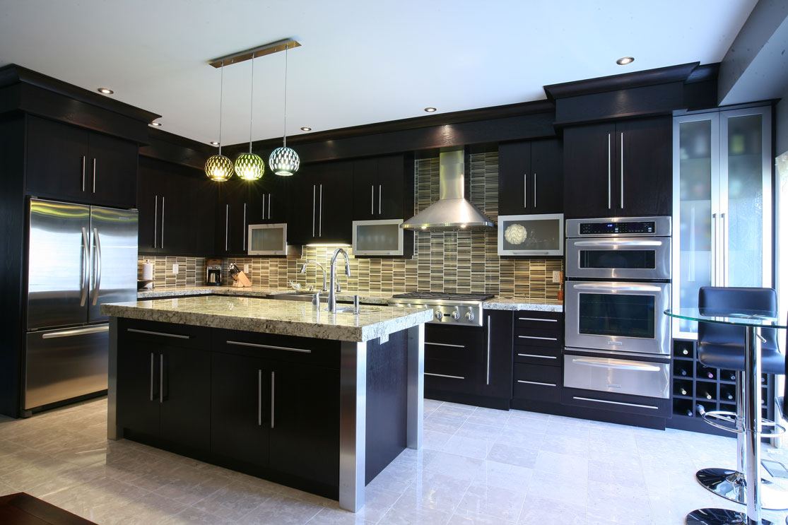 Kitchen remodel with dark shaker cabinets, granite island and stainless appliances